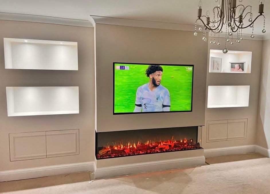 Finished fireplace media wall with lit alcoves