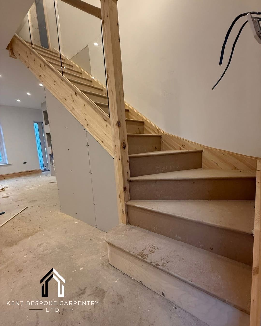 Softwood staircase with glass balustrade